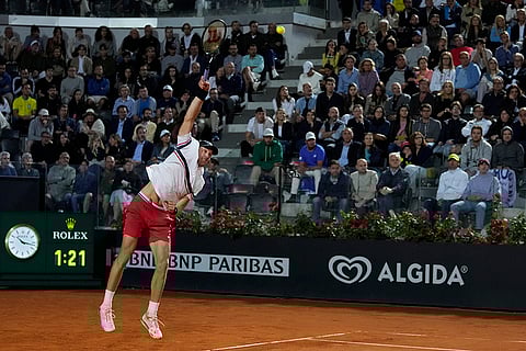 Nicolas Jarry serves the ball to Tommy Paul